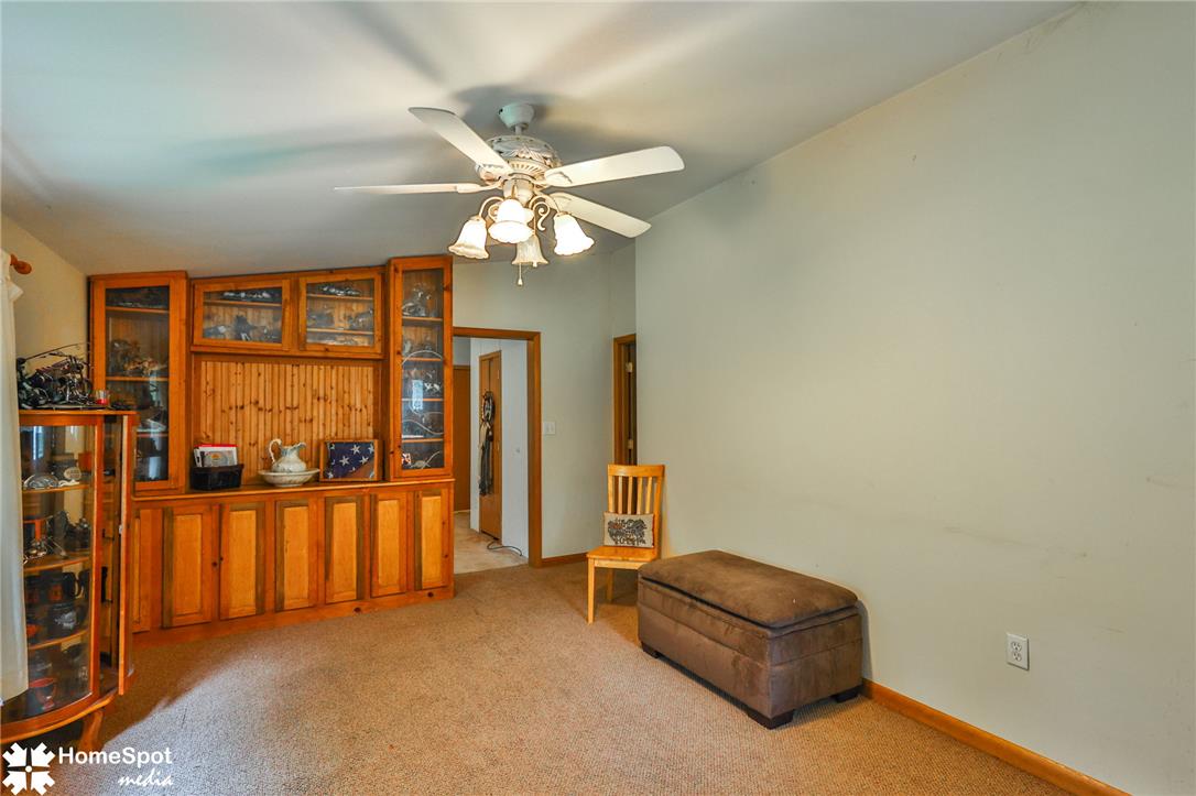3795 Rhoades Road Kempton, PA 19529 - Photo 26 of 42 A living space offers a built-in entertainment center and a ceiling fan for comfort.