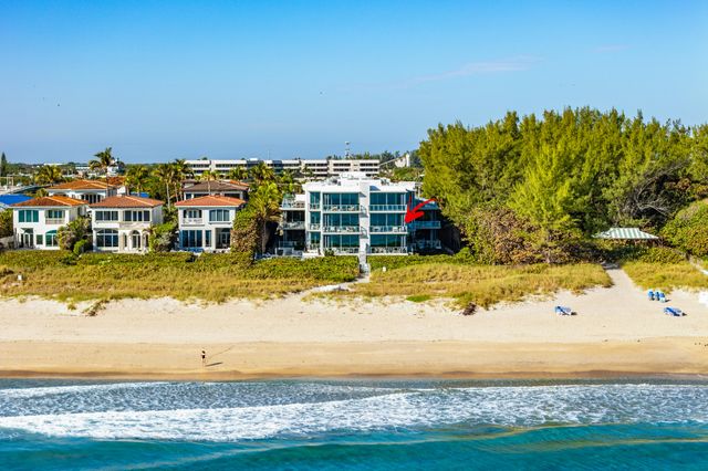 a view of a swimming pool with an ocean view