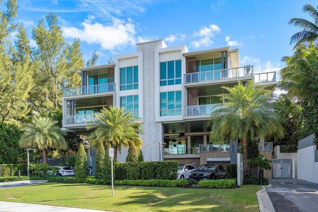 a view of a building with a yard