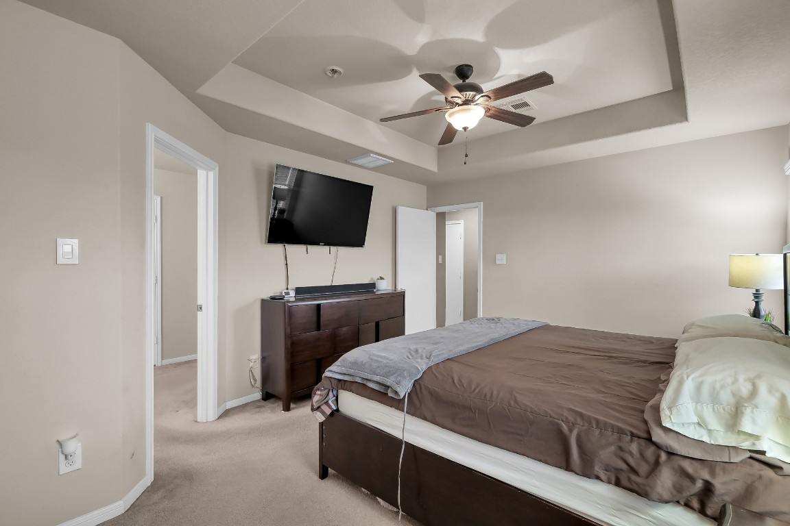 29341 Forest Floor Lane Spring, TX 77386 - Photo 19 of 41 a bedroom with a bed and a flat screen tv