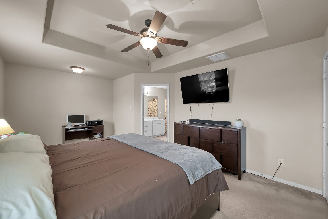 29341 Forest Floor Lane Spring, TX 77386 - Photo 20 of 41 a bedroom with a bed and a flat screen tv