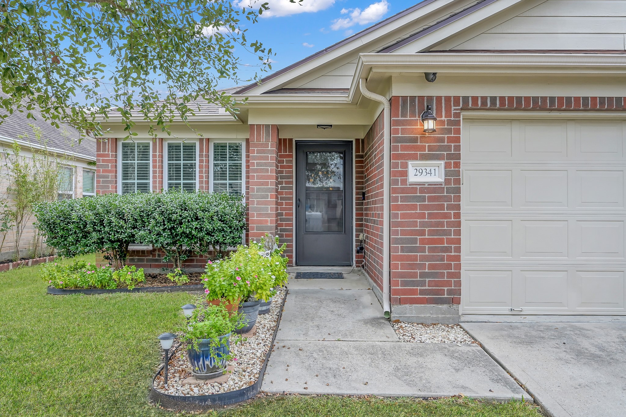 29341 Forest Floor Lane Spring, TX 77386 - Photo 2 of 41 a front view of a house with a yard