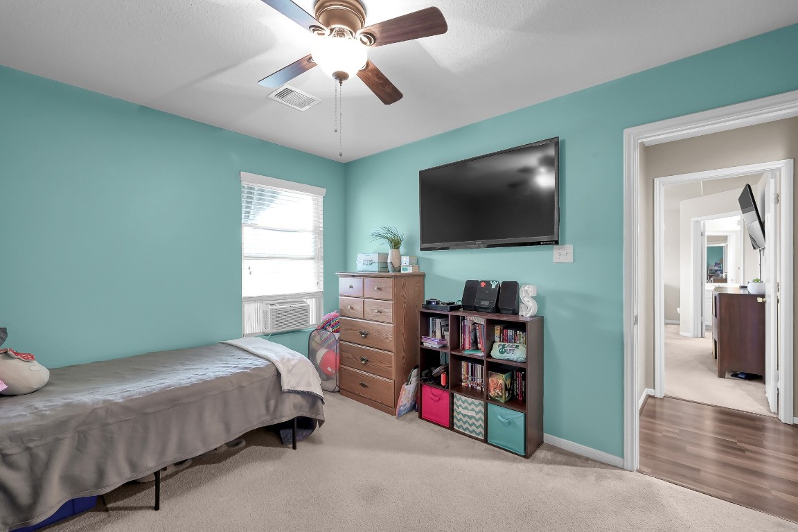 29341 Forest Floor Lane Spring, TX 77386 - Photo 23 of 41 a bedroom with bed and a flat screen tv