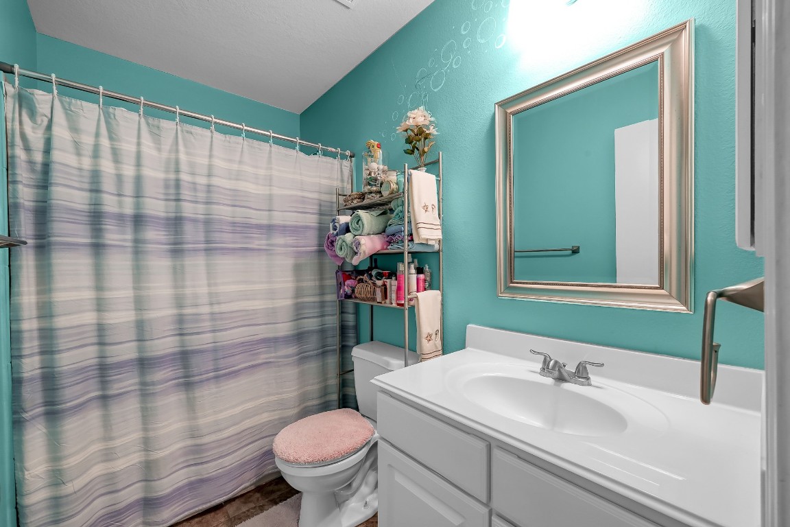 29341 Forest Floor Lane Spring, TX 77386 - Photo 26 of 41 a bathroom with a sink a toilet and shower