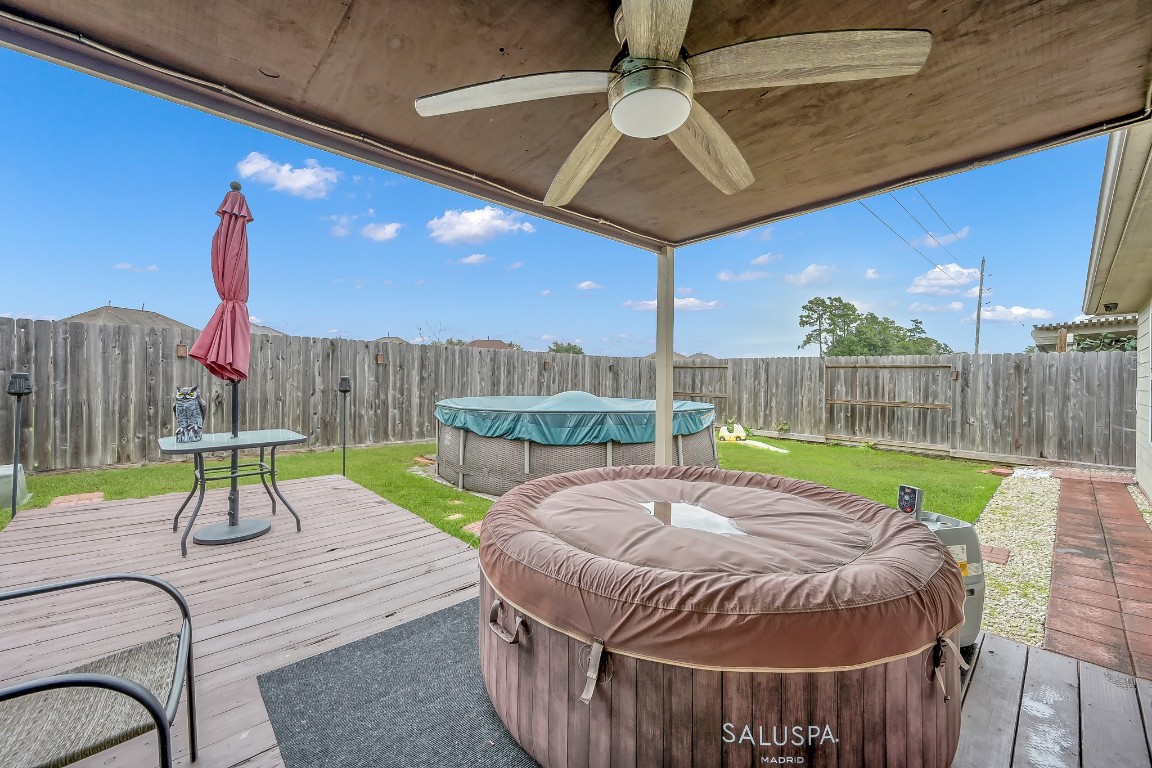 29341 Forest Floor Lane Spring, TX 77386 - Photo 32 of 41 a view of a backyard with table and chairs with wooden fence