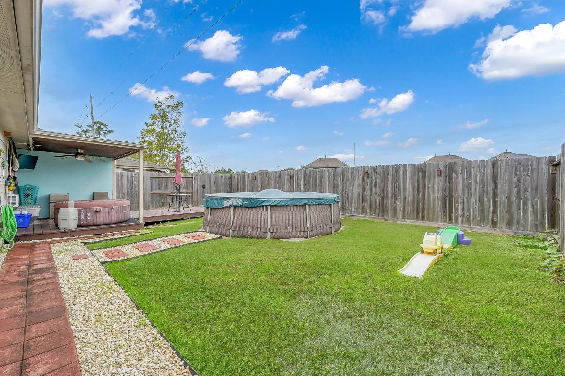 29341 Forest Floor Lane Spring, TX 77386 - Photo 34 of 41 a view of a backyard with a garden and entertaining space