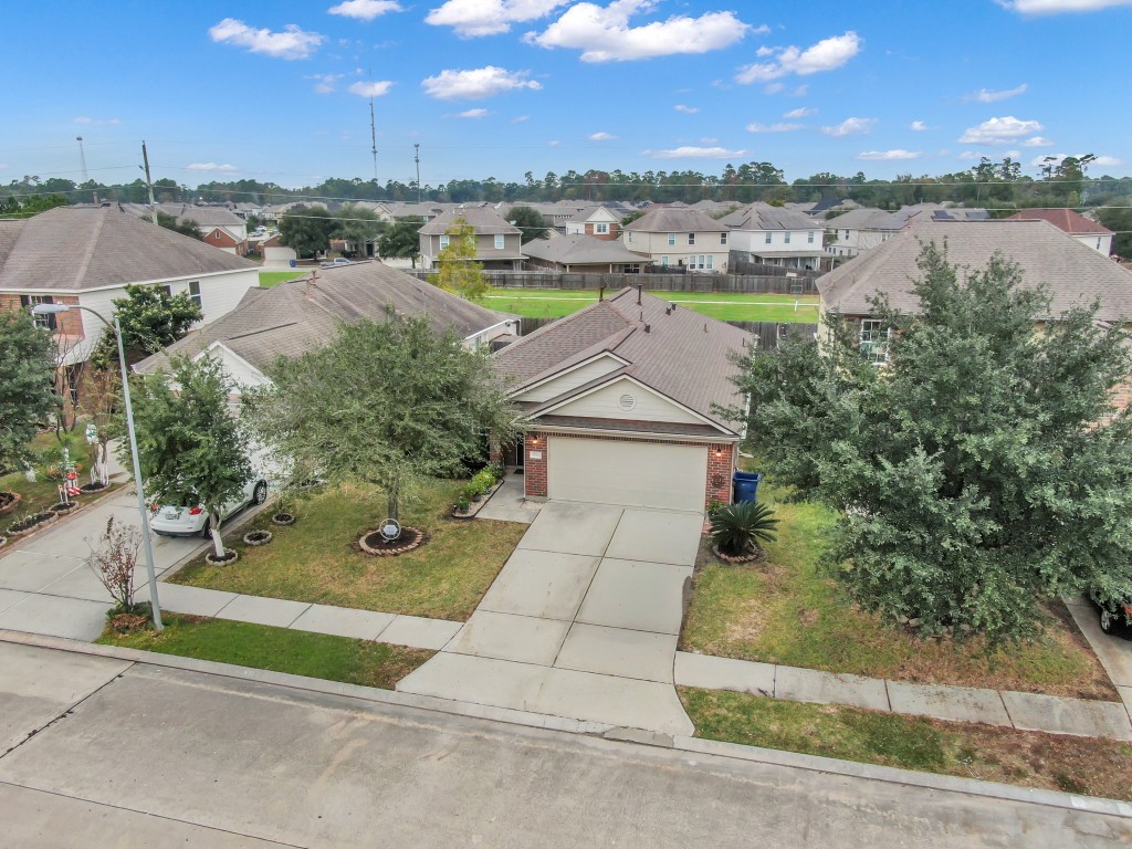 29341 Forest Floor Lane Spring, TX 77386 - Photo 37 of 41 an aerial view of residential houses with outdoor space and ocean view