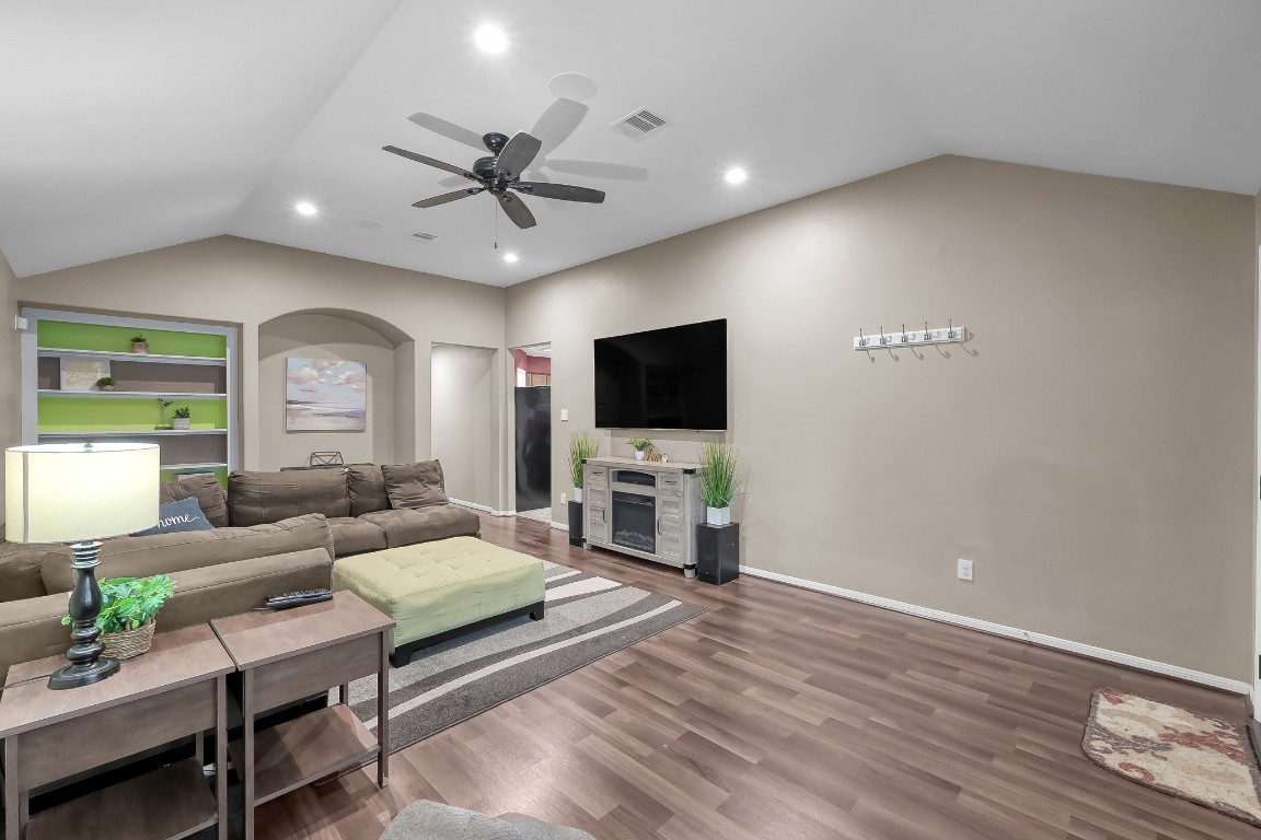 29341 Forest Floor Lane Spring, TX 77386 - Photo 4 of 41 a living room with furniture and a flat screen tv