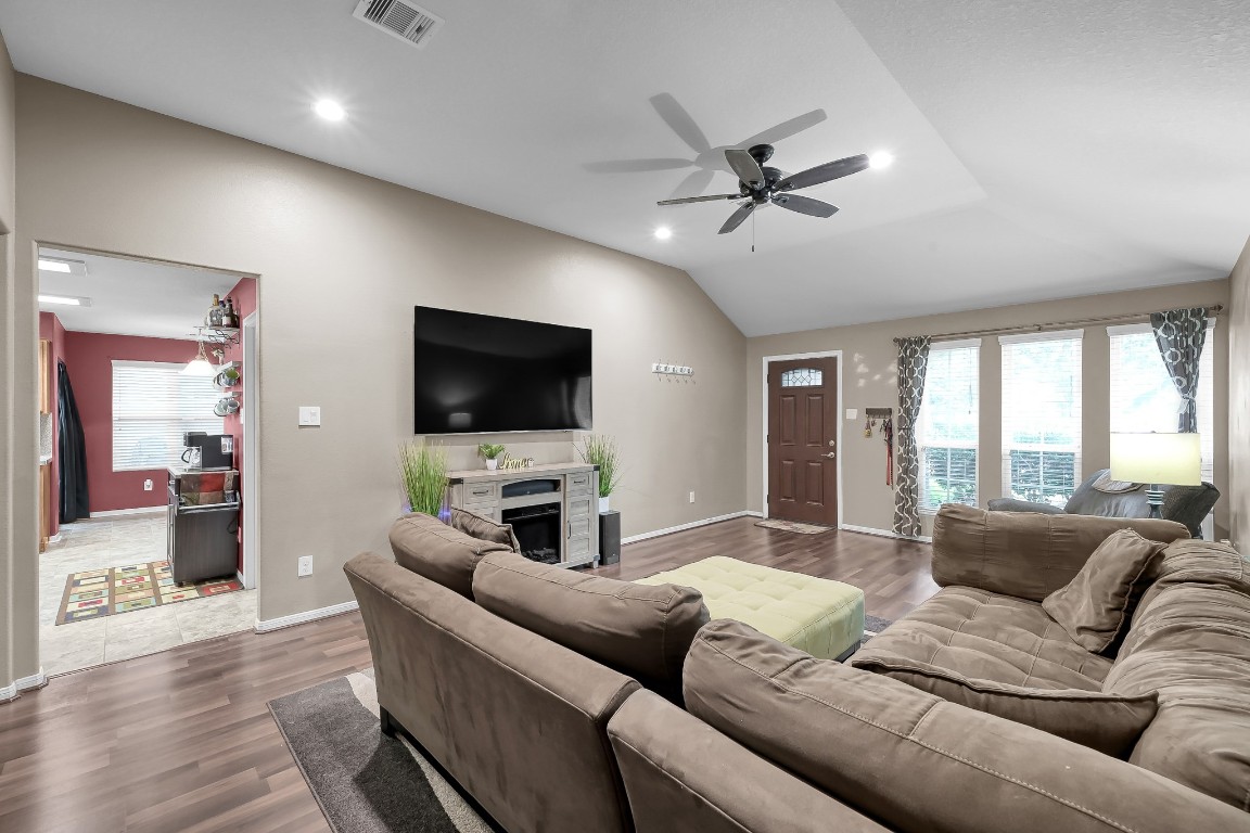 29341 Forest Floor Lane Spring, TX 77386 - Photo 7 of 41 a living room with furniture and a flat screen tv