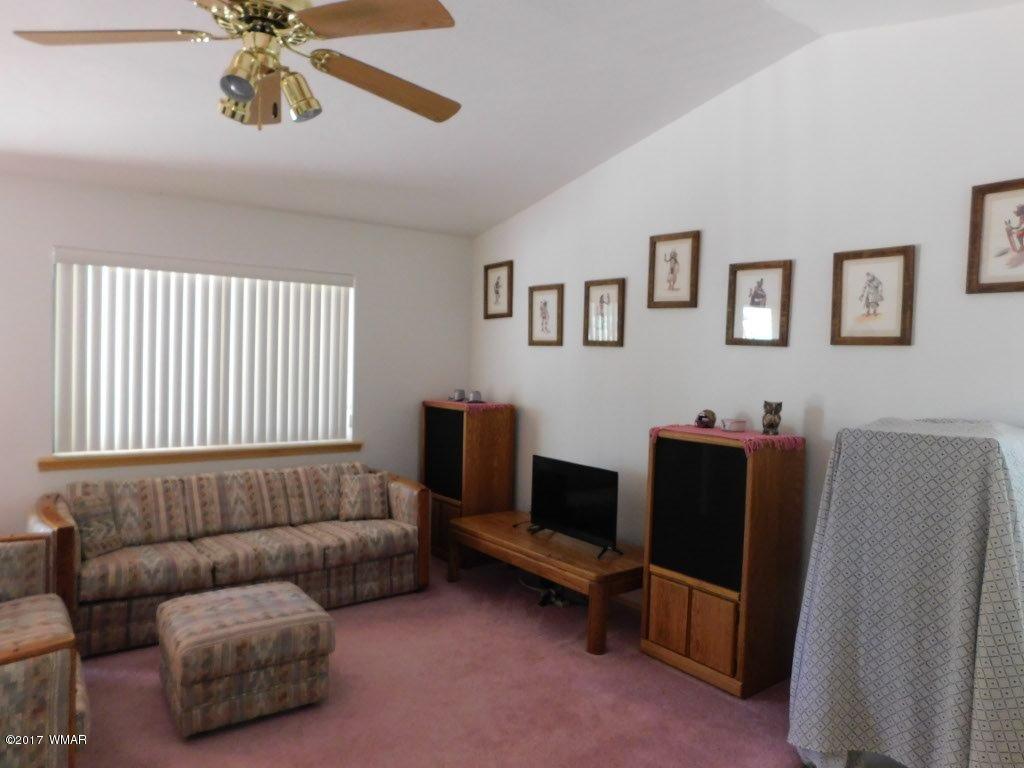 2749 Canyon Ridge Road Overgaard, AZ 85933 - Photo 17 of 25 a living room with furniture and a window