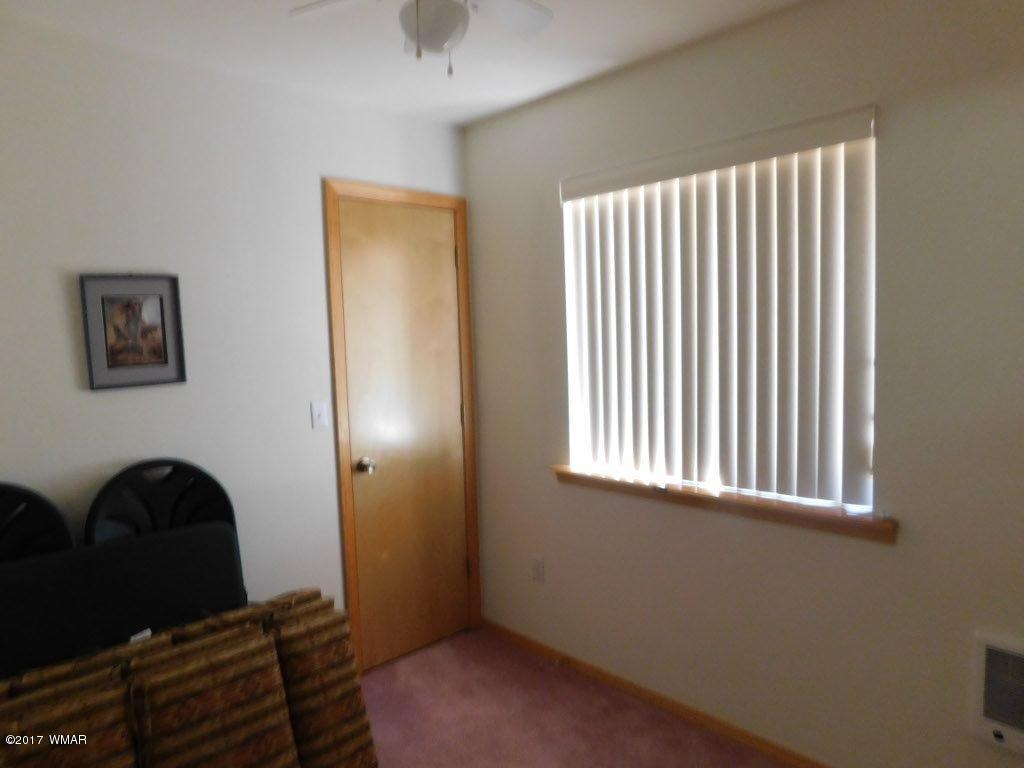 2749 Canyon Ridge Road Overgaard, AZ 85933 - Photo 24 of 25 a view of a room that has a window in it