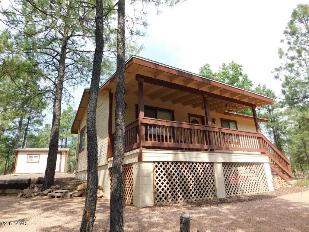 2749 Canyon Ridge Road Overgaard, AZ 85933 - Photo 3 of 25 a front view of a house