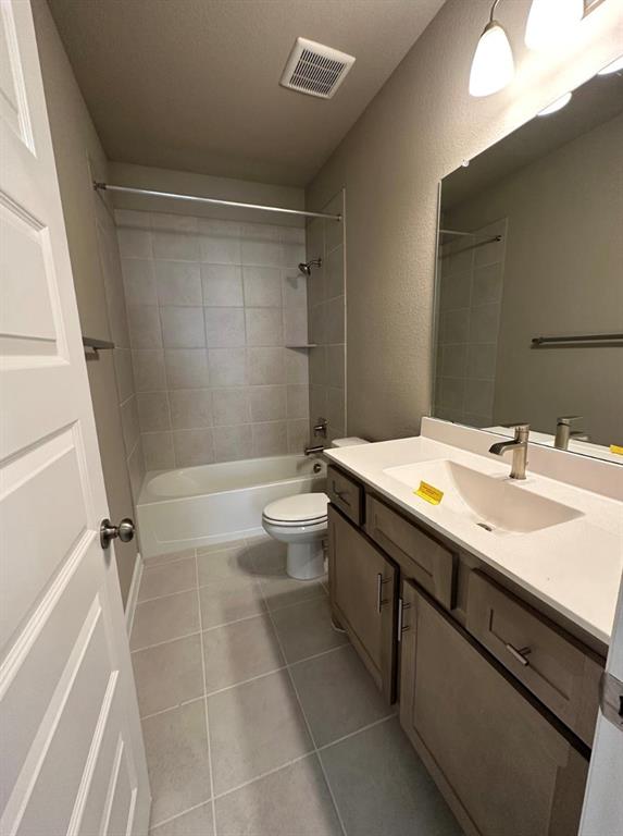 2525 Four Roses Drive Lewisville, TX 75056 - Photo 10 of 19 a bathroom with a sink a toilet and shower