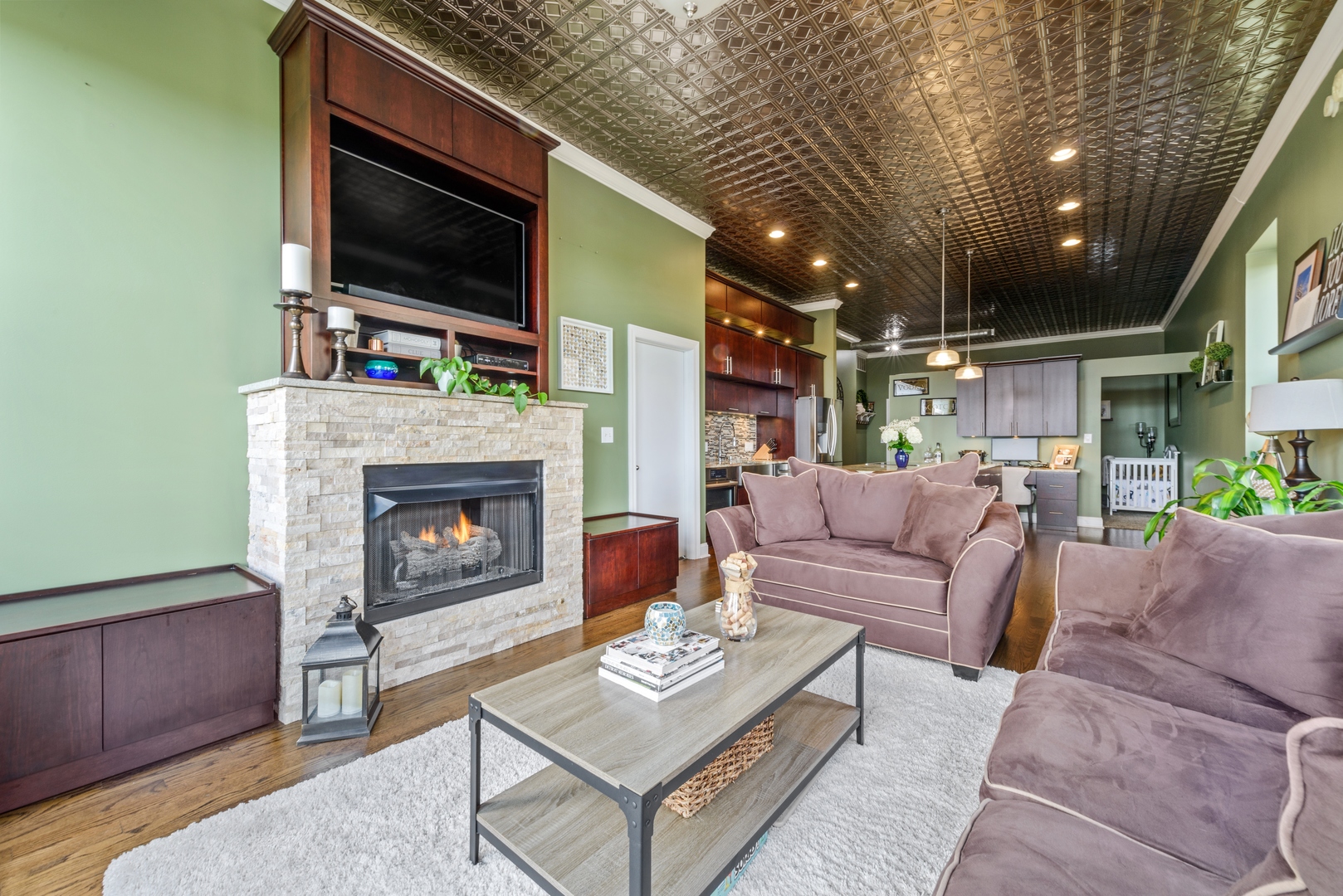 811 South Lytle Street, Unit 606 Chicago, IL 60607 - Photo 11 of 23 a living room with furniture a flat screen tv and a fireplace