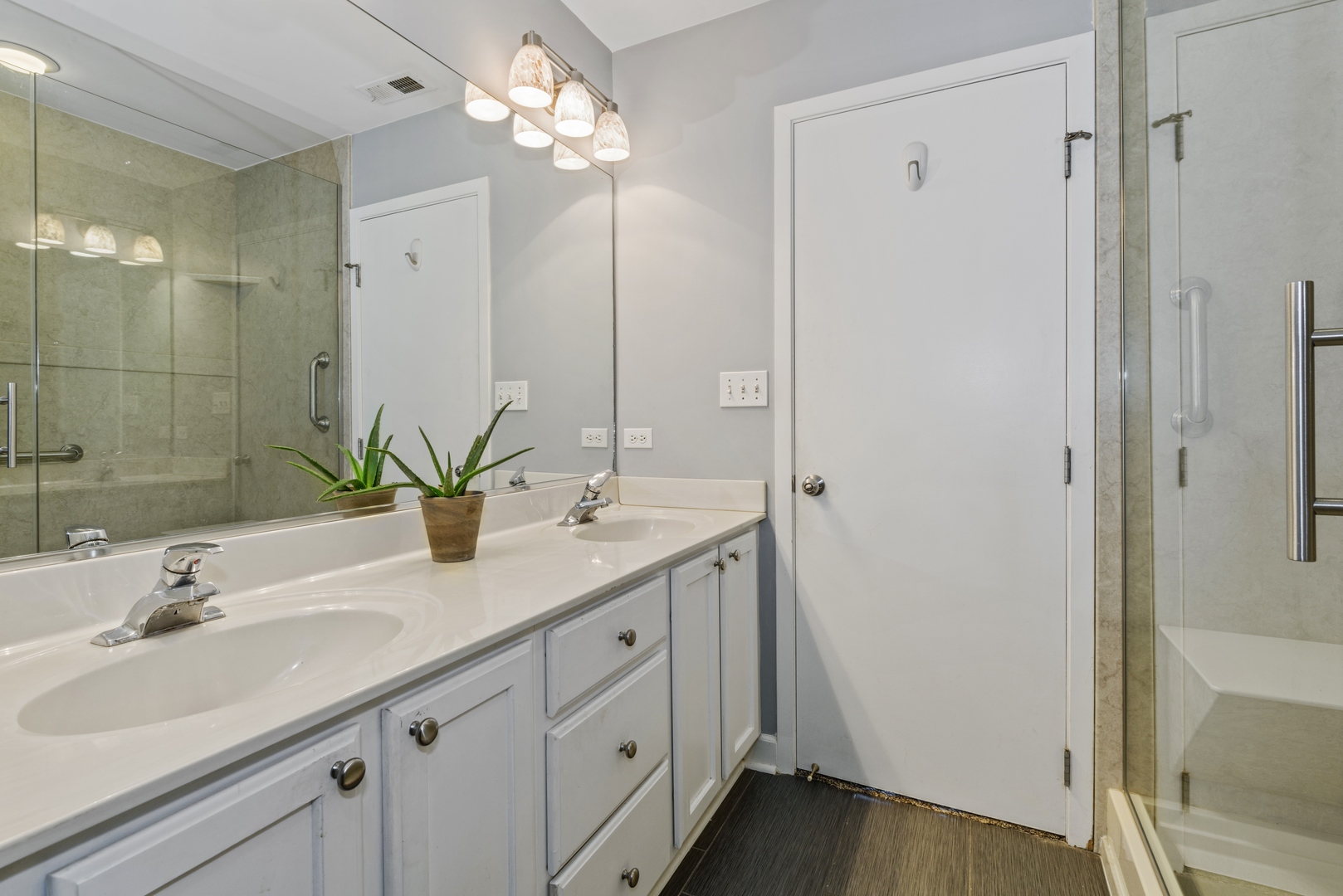 811 South Lytle Street, Unit 606 Chicago, IL 60607 - Photo 15 of 23 a bathroom with a sink double vanity granite tub and shower