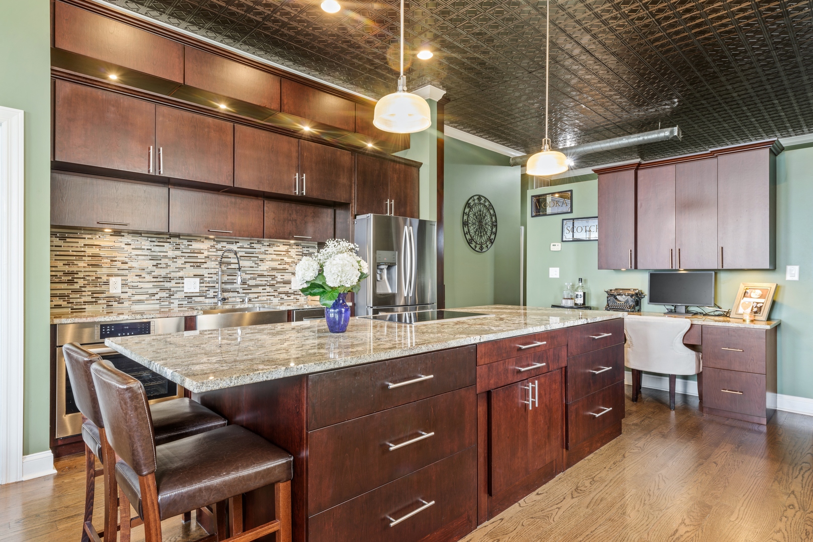 811 South Lytle Street, Unit 606 Chicago, IL 60607 - Photo 7 of 23 a kitchen with a sink cabinets and wooden floor