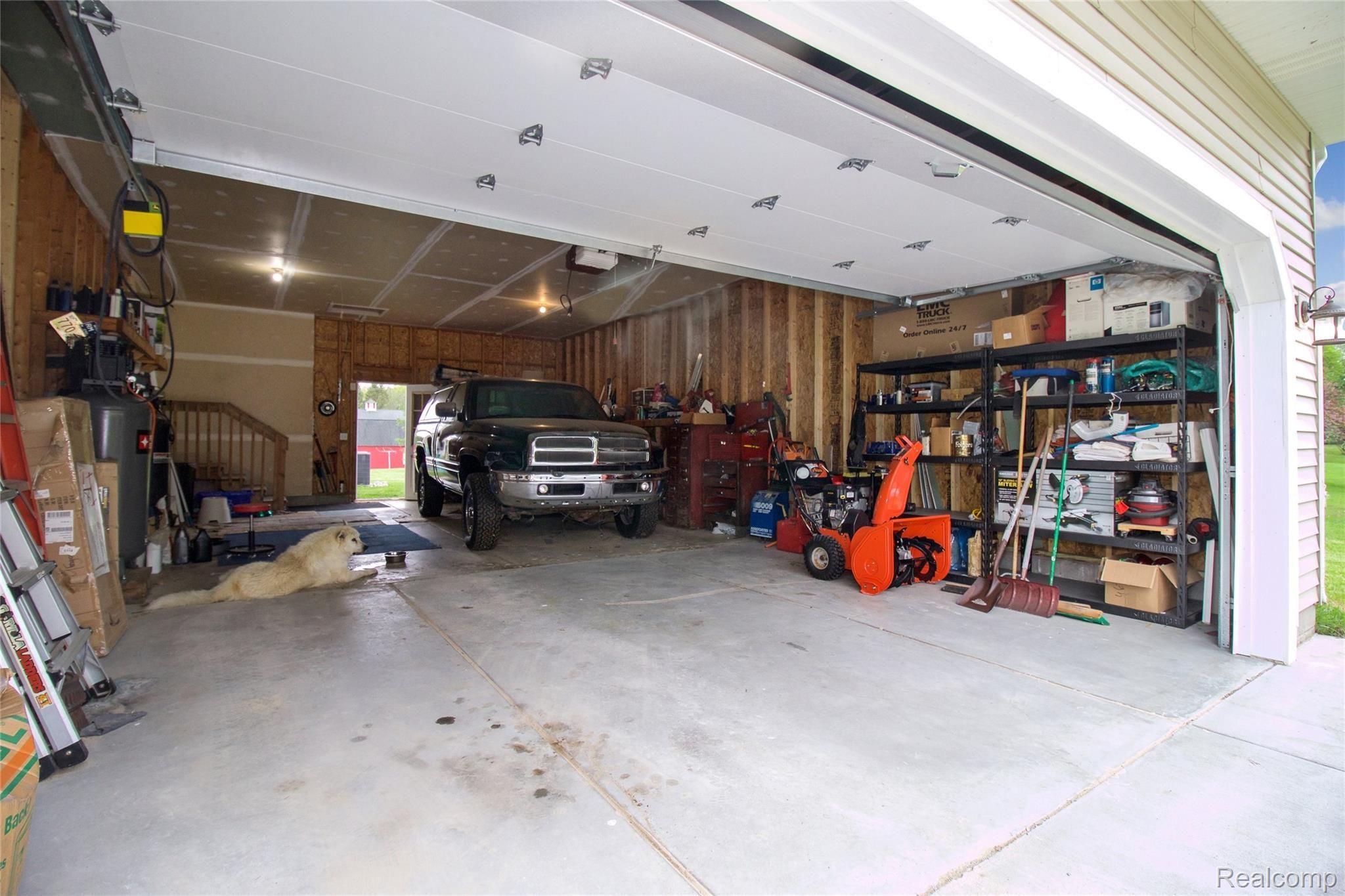 2552 Swarthout Road Pinckney, MI 48169 - Photo 47 of 50 Garage interior. Room for at least 3 cars!