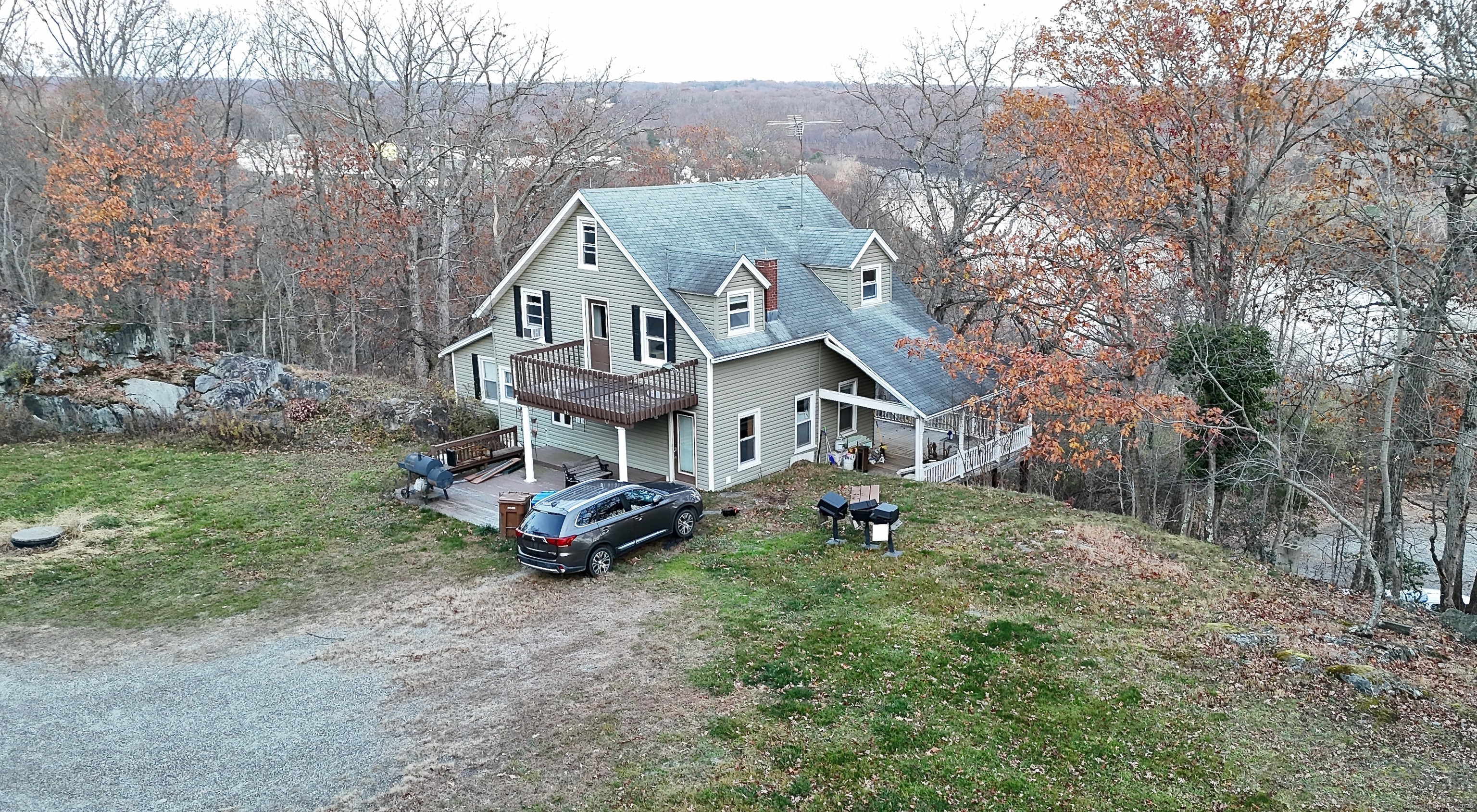 a aerial view of a house with a yard
