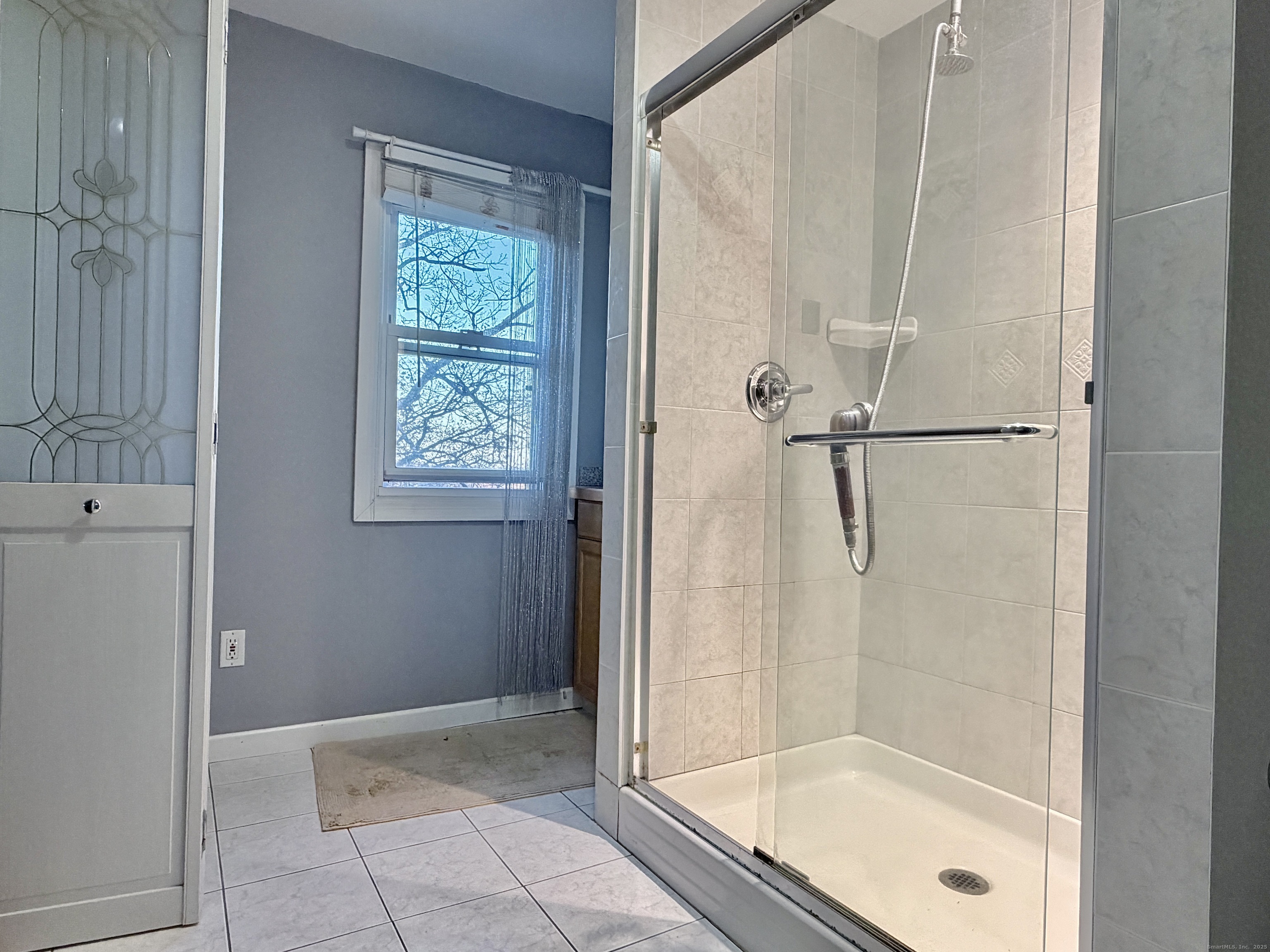 88 Rocky Rest Road Shelton, CT 06484 - Photo 12 of 21 a bathroom with a glass shower door