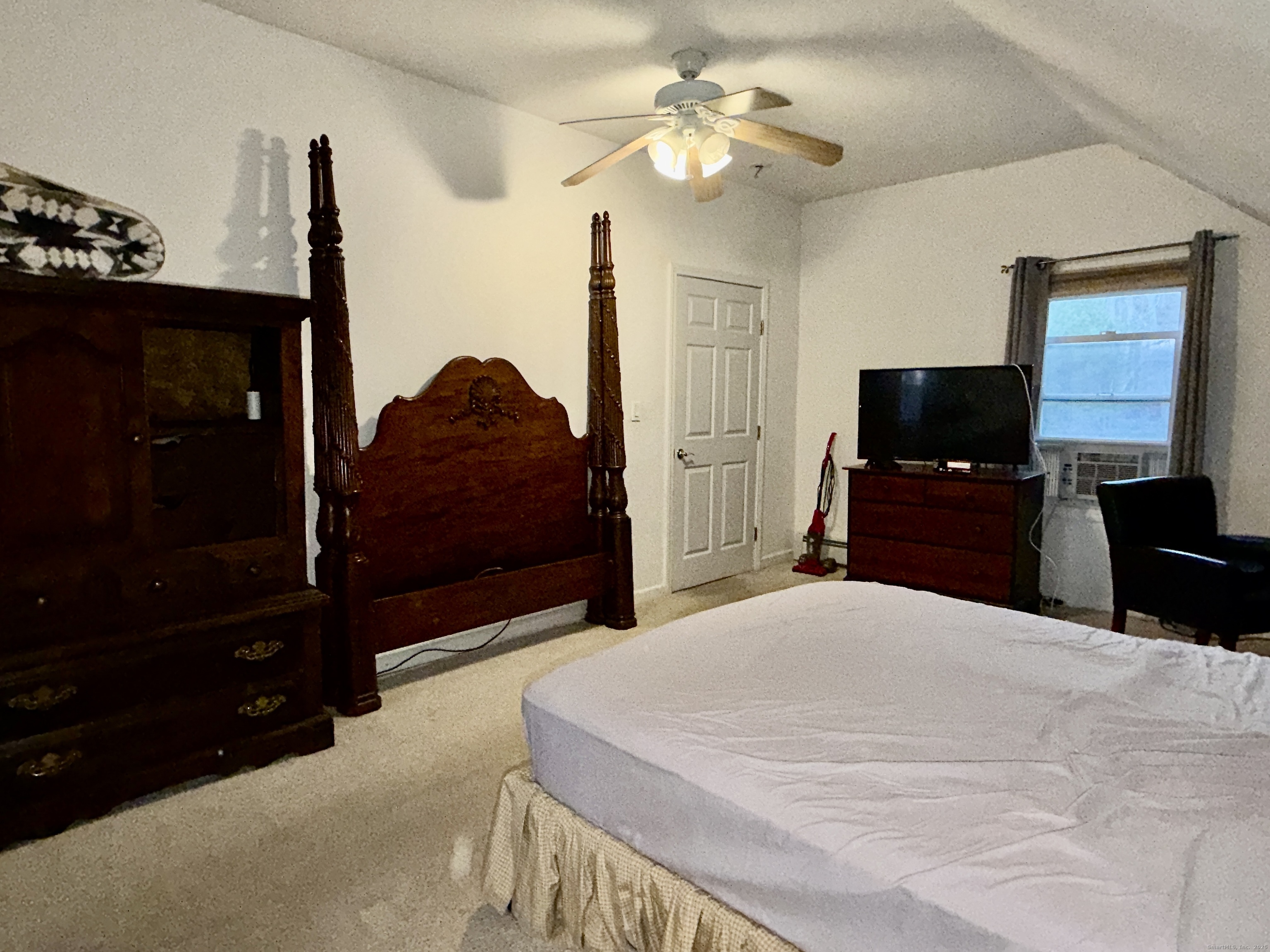 88 Rocky Rest Road Shelton, CT 06484 - Photo 15 of 21 a bedroom with a bed and a flat tv screen on dresser