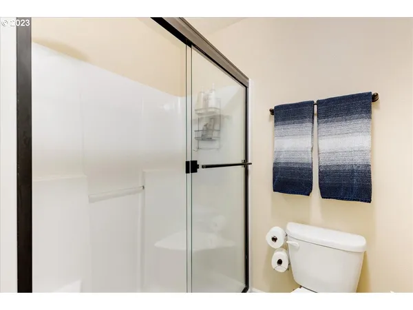 a bathroom with a shower and a sink
