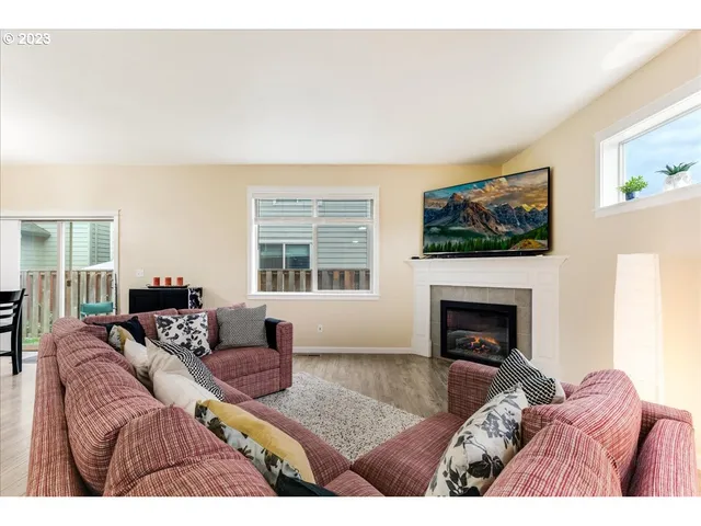 a bedroom with furniture and a fireplace