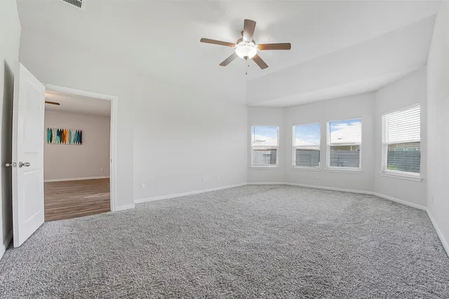 a bathroom with a shower sink and mirror