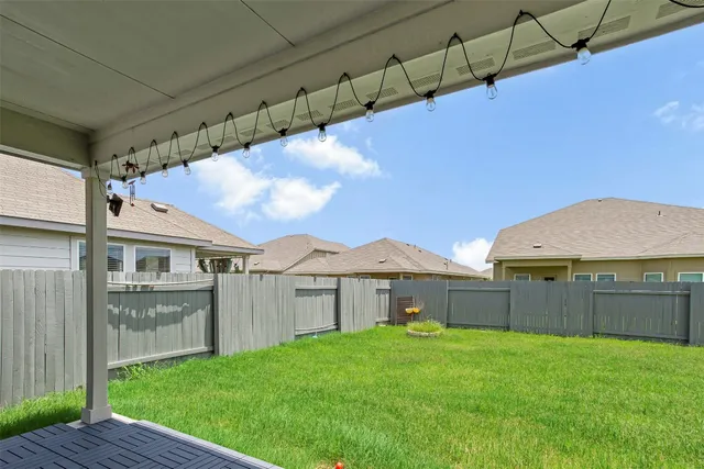 a view of a backyard with a garden and plants