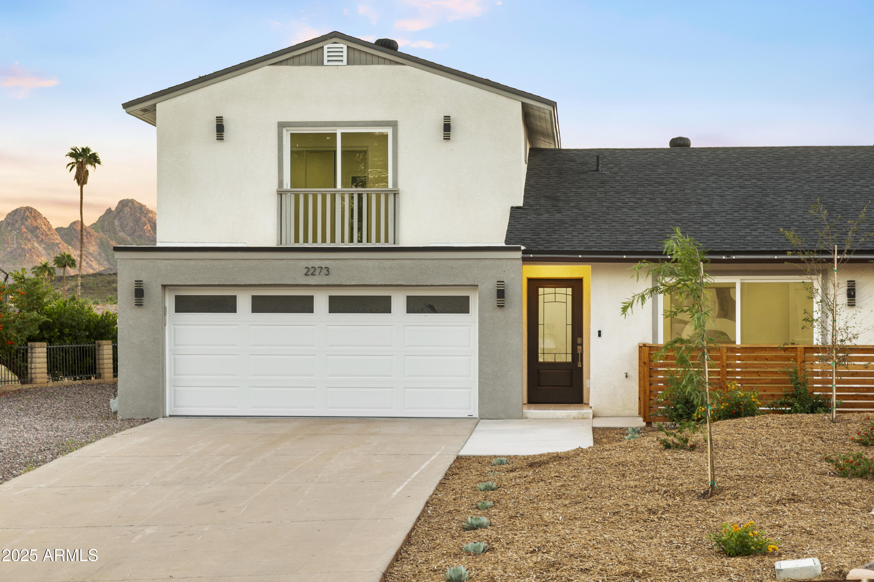 a front view of a house with a garage