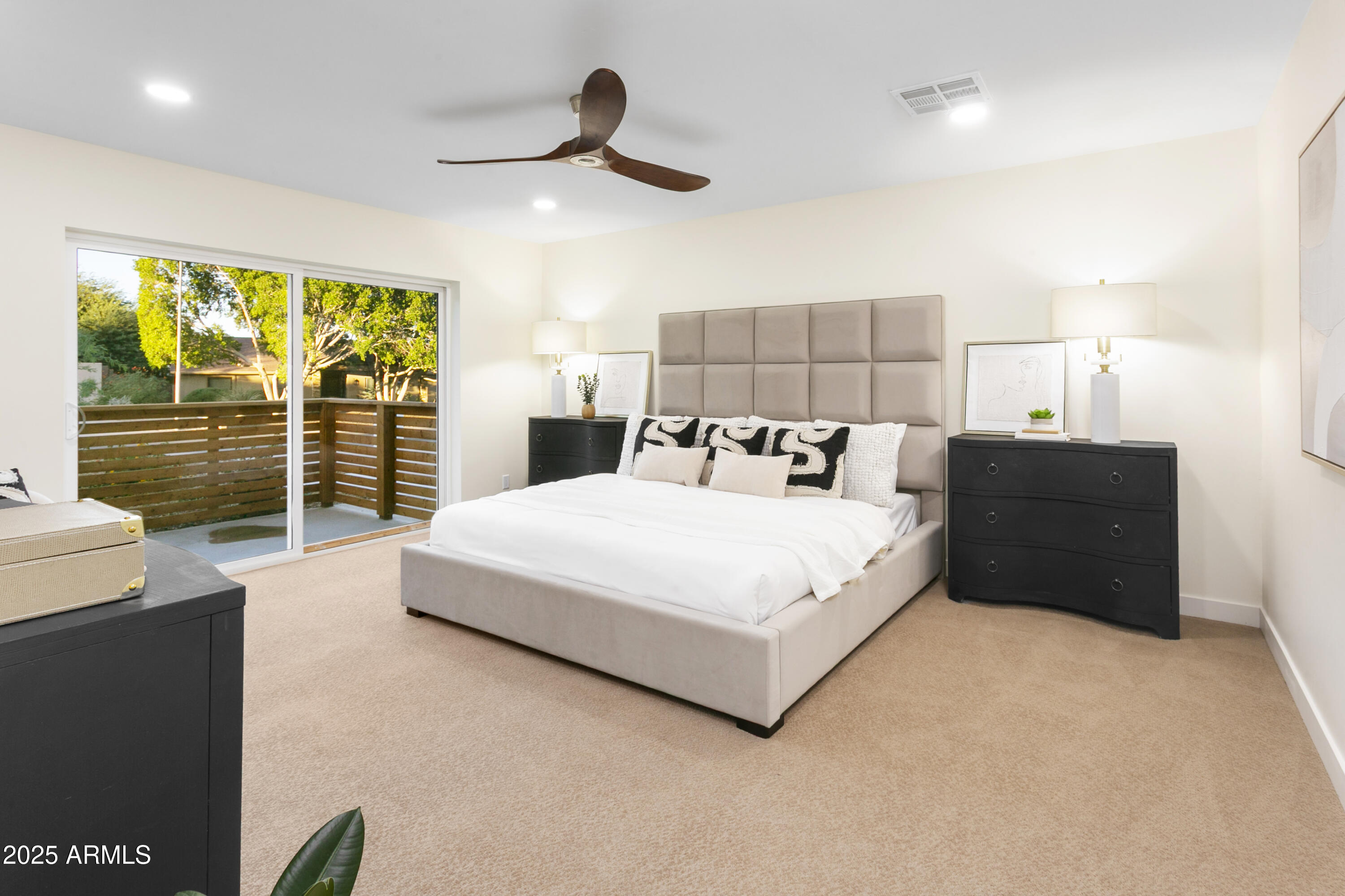 2273 East Clinton Street Phoenix, AZ 85028 - Photo 12 of 30 a bedroom with a large bed and a large window