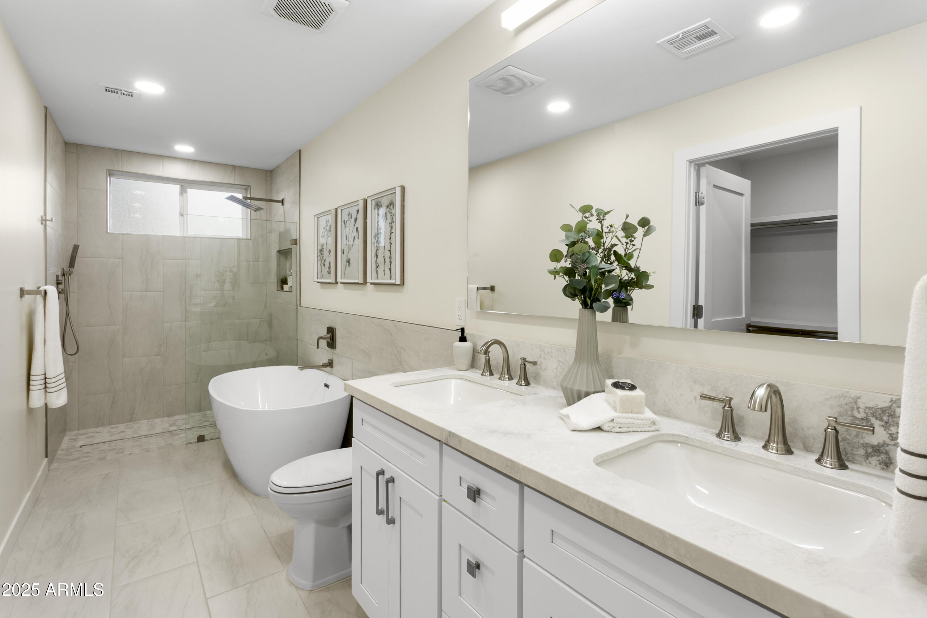 2273 East Clinton Street Phoenix, AZ 85028 - Photo 15 of 30 a bathroom with a double vanity sink mirror and toilet