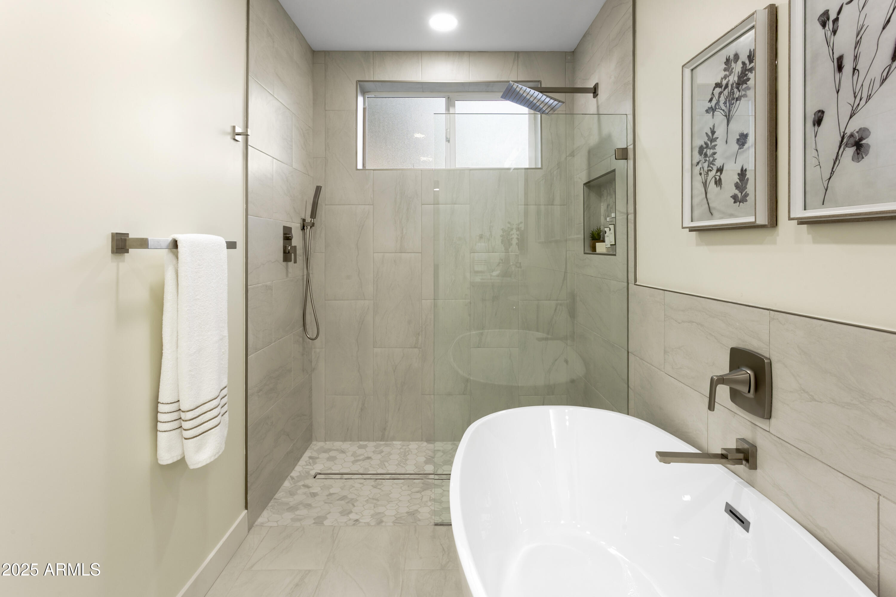 2273 East Clinton Street Phoenix, AZ 85028 - Photo 16 of 30 a bathroom with a bathtub and shower