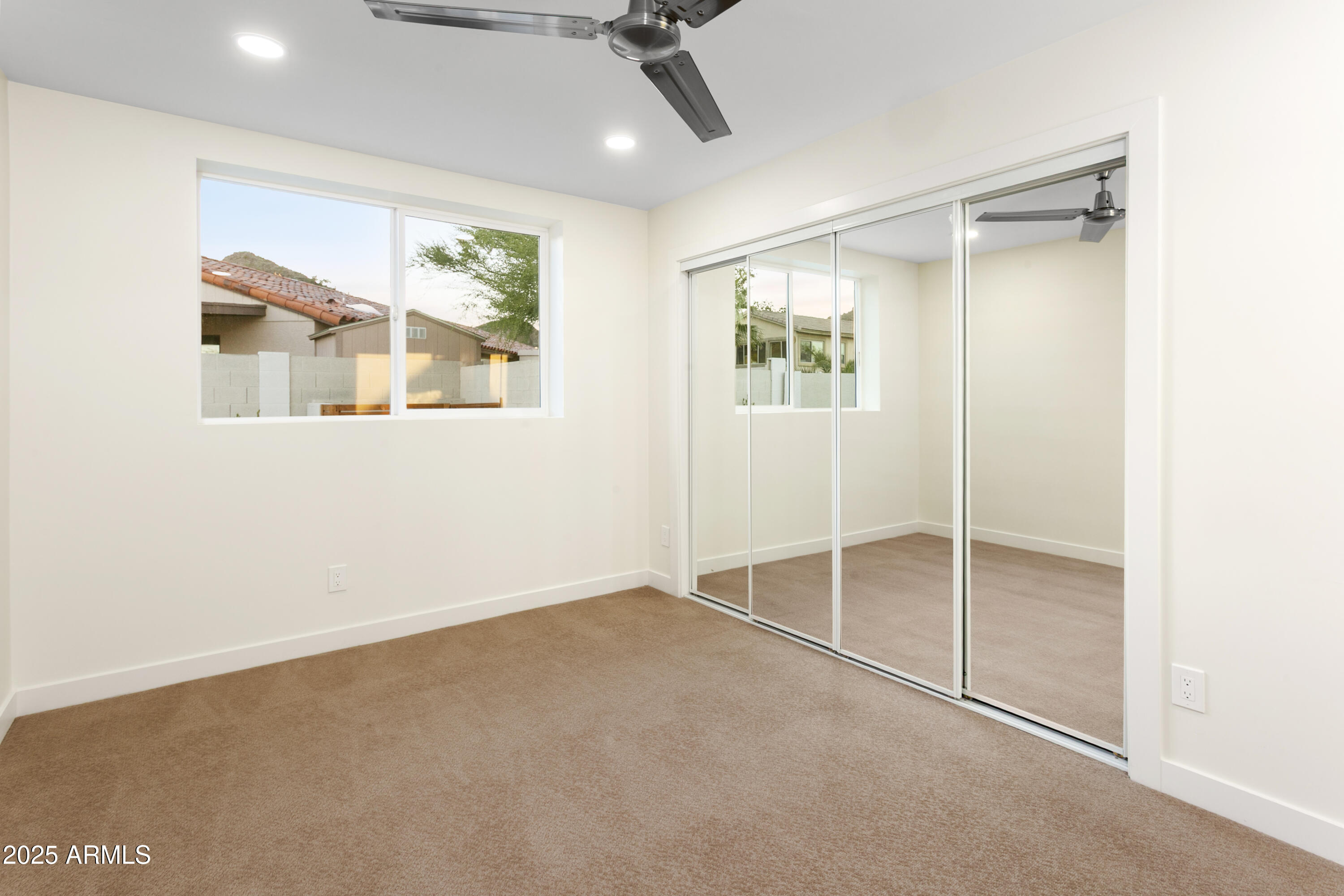 2273 East Clinton Street Phoenix, AZ 85028 - Photo 19 of 30 a view of an empty room with a window