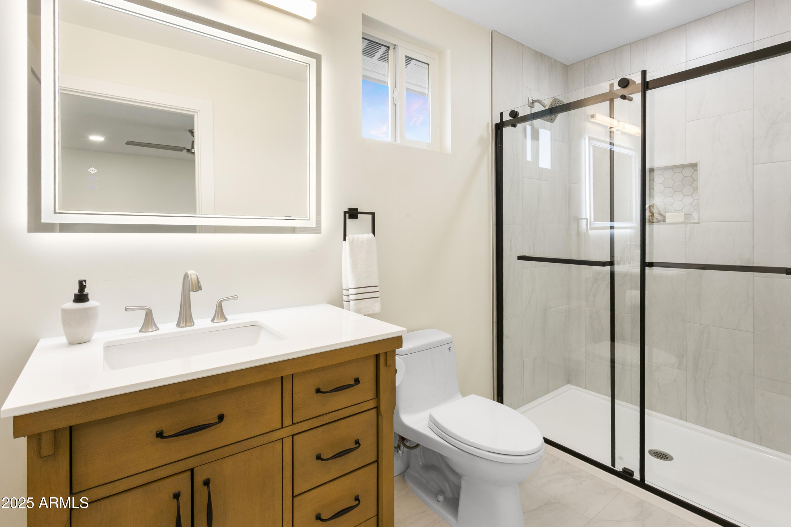 2273 East Clinton Street Phoenix, AZ 85028 - Photo 24 of 30 a bathroom with a sink toilet and shower