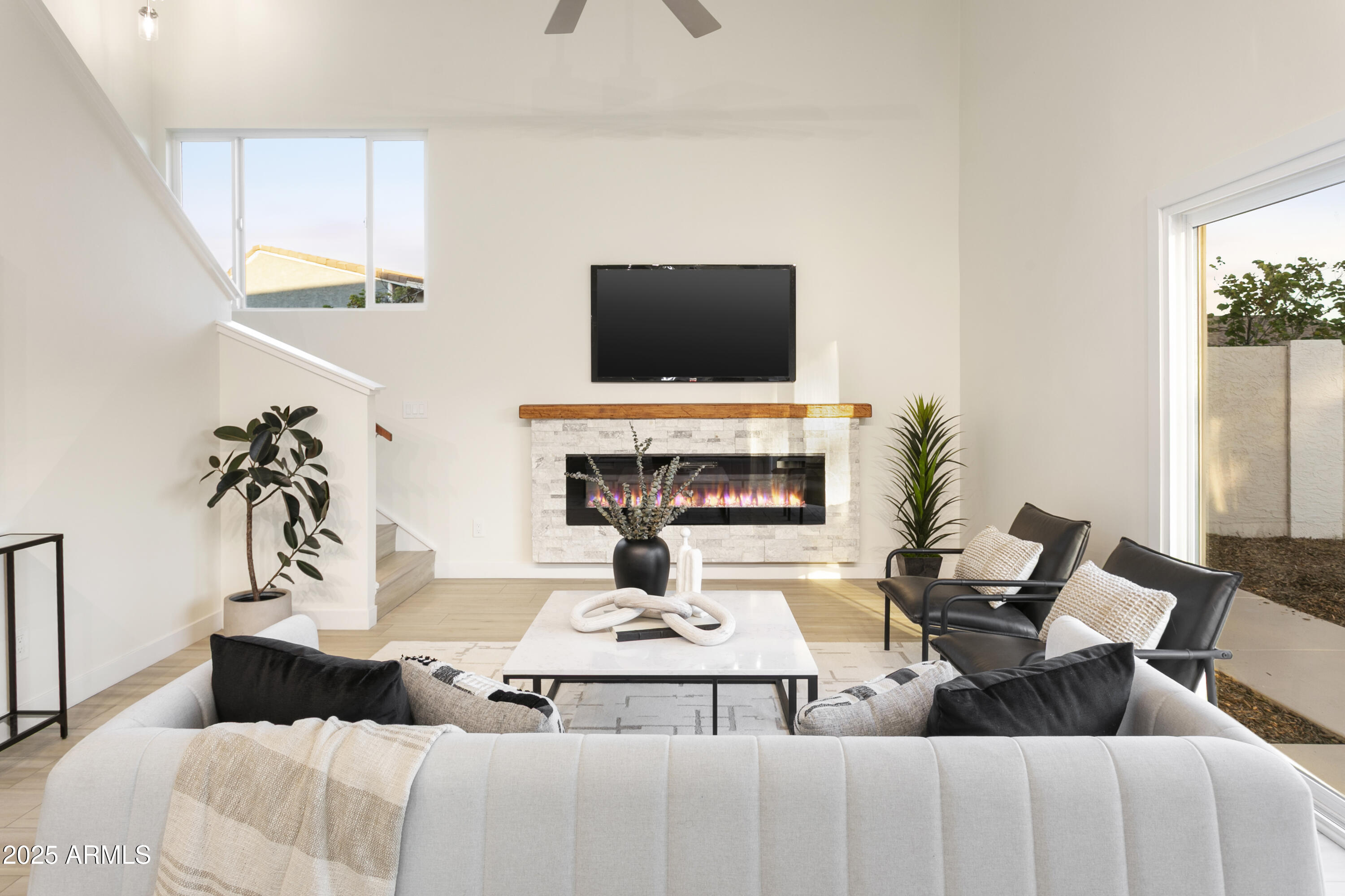 2273 East Clinton Street Phoenix, AZ 85028 - Photo 10 of 30 a living room with furniture and a flat screen tv