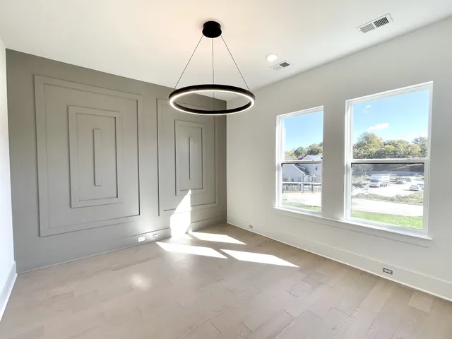 a kitchen with stainless steel appliances granite countertop a sink a oven and a refrigerator