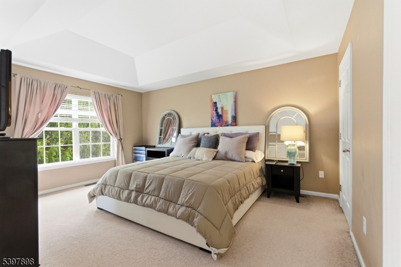 106 Limerick Lane Phillipsburg, NJ 08865 - Photo 13 of 23 a spacious bedroom with a bed and a large window