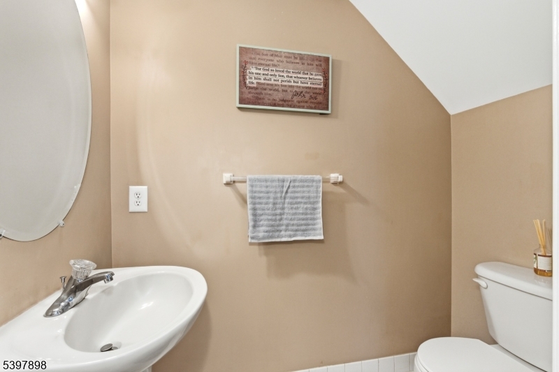 106 Limerick Lane Phillipsburg, NJ 08865 - Photo 16 of 23 a bathroom with a toilet a sink and a mirror