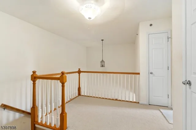 a view of a hallway with staircase
