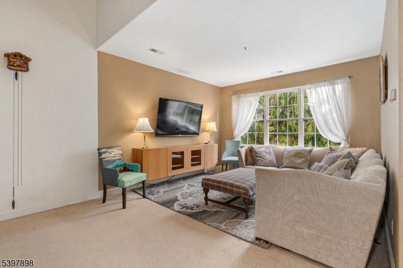 106 Limerick Lane Phillipsburg, NJ 08865 - Photo 6 of 23 a living room with furniture and a flat screen tv