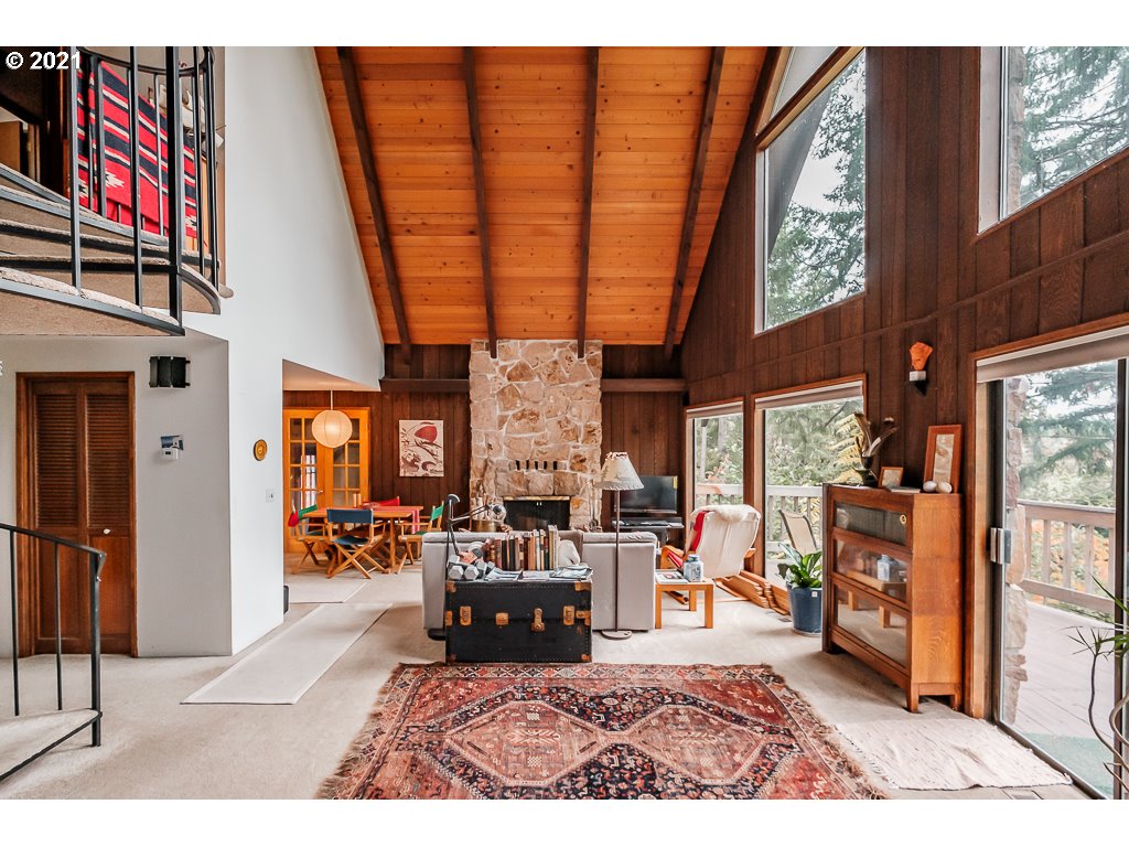 4580 Old Dillard Road Eugene, OR 97405 - Photo 4 of 29 a living room with furniture a fireplace and a large window