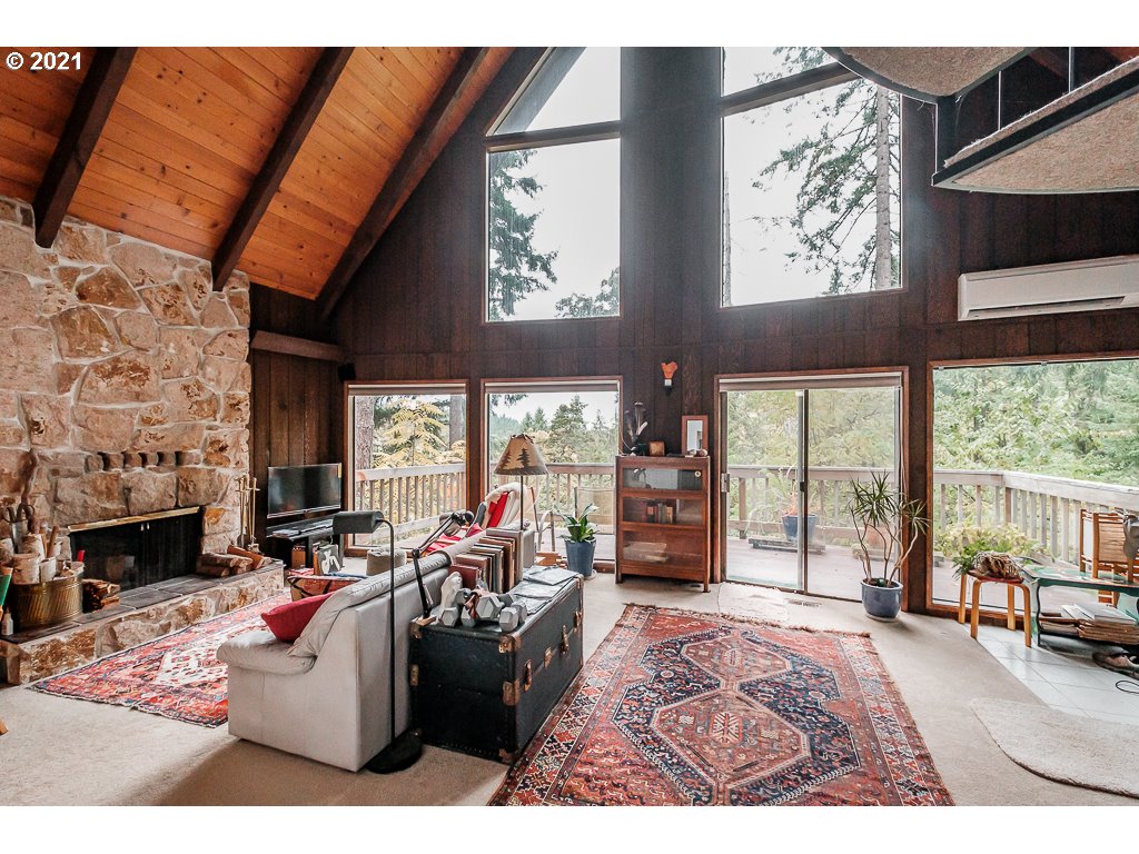 4580 Old Dillard Road Eugene, OR 97405 - Photo 5 of 29 a living room with furniture a flat screen tv and a fireplace