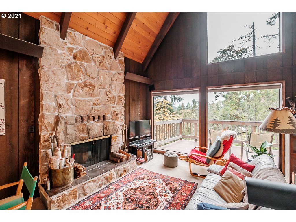 4580 Old Dillard Road Eugene, OR 97405 - Photo 7 of 29 a living room with furniture a rug and a fireplace