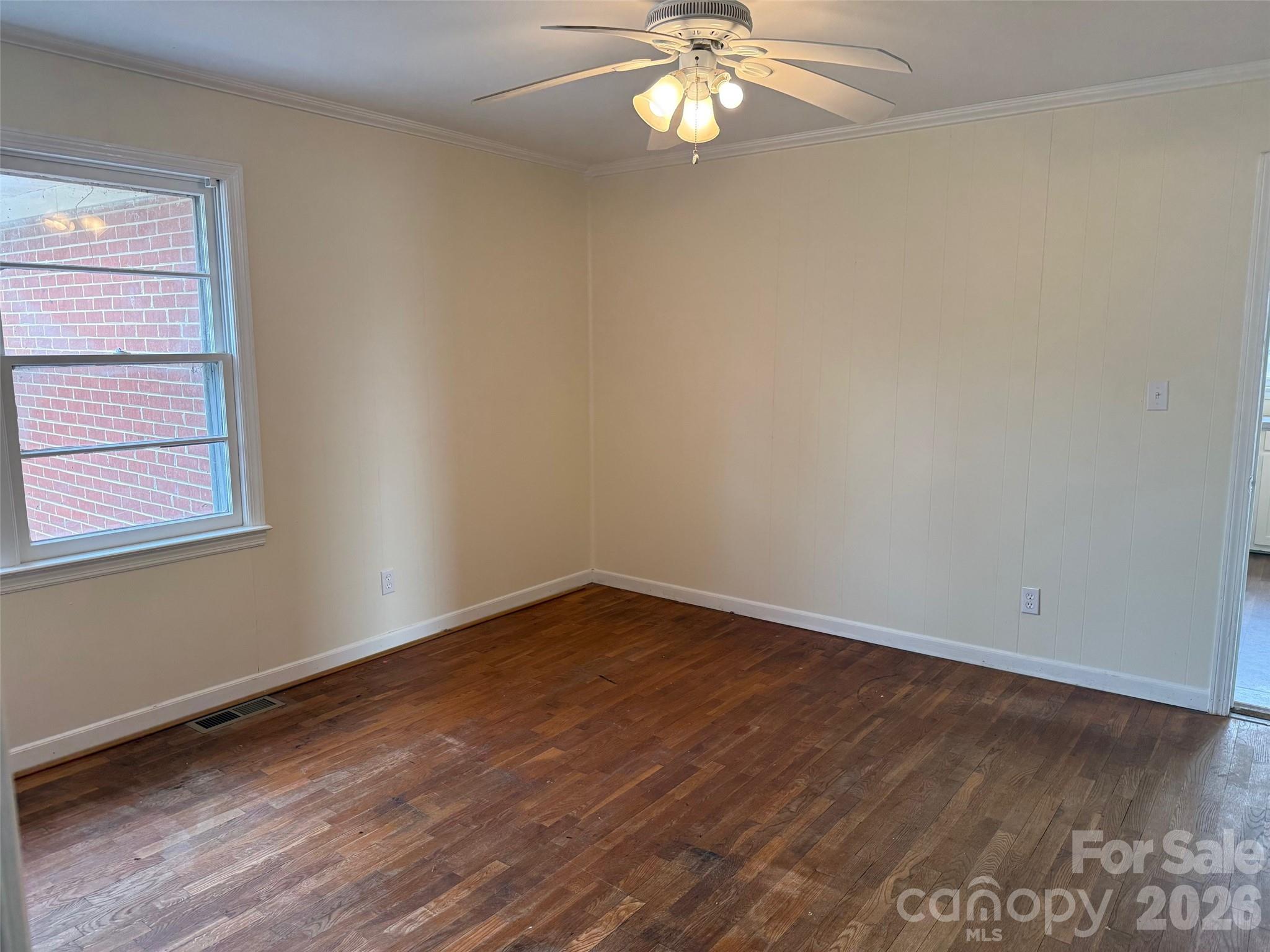 292 Youngs Bend Road Kershaw, SC 29067 - Photo 16 of 18 a view of an empty room with wooden floor and a window