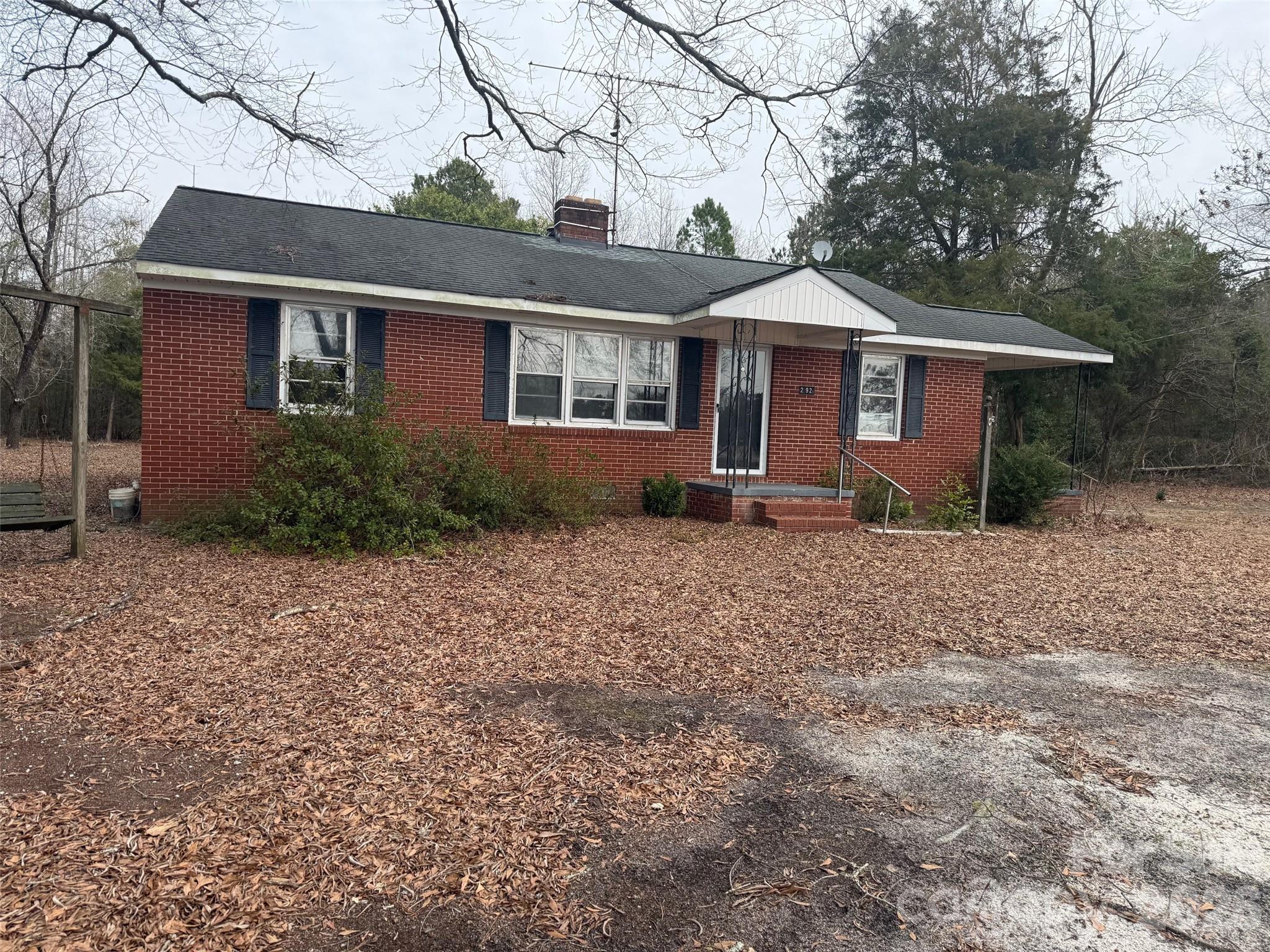 292 Youngs Bend Road Kershaw, SC 29067 - Photo 2 of 18 a front view of a house with garden