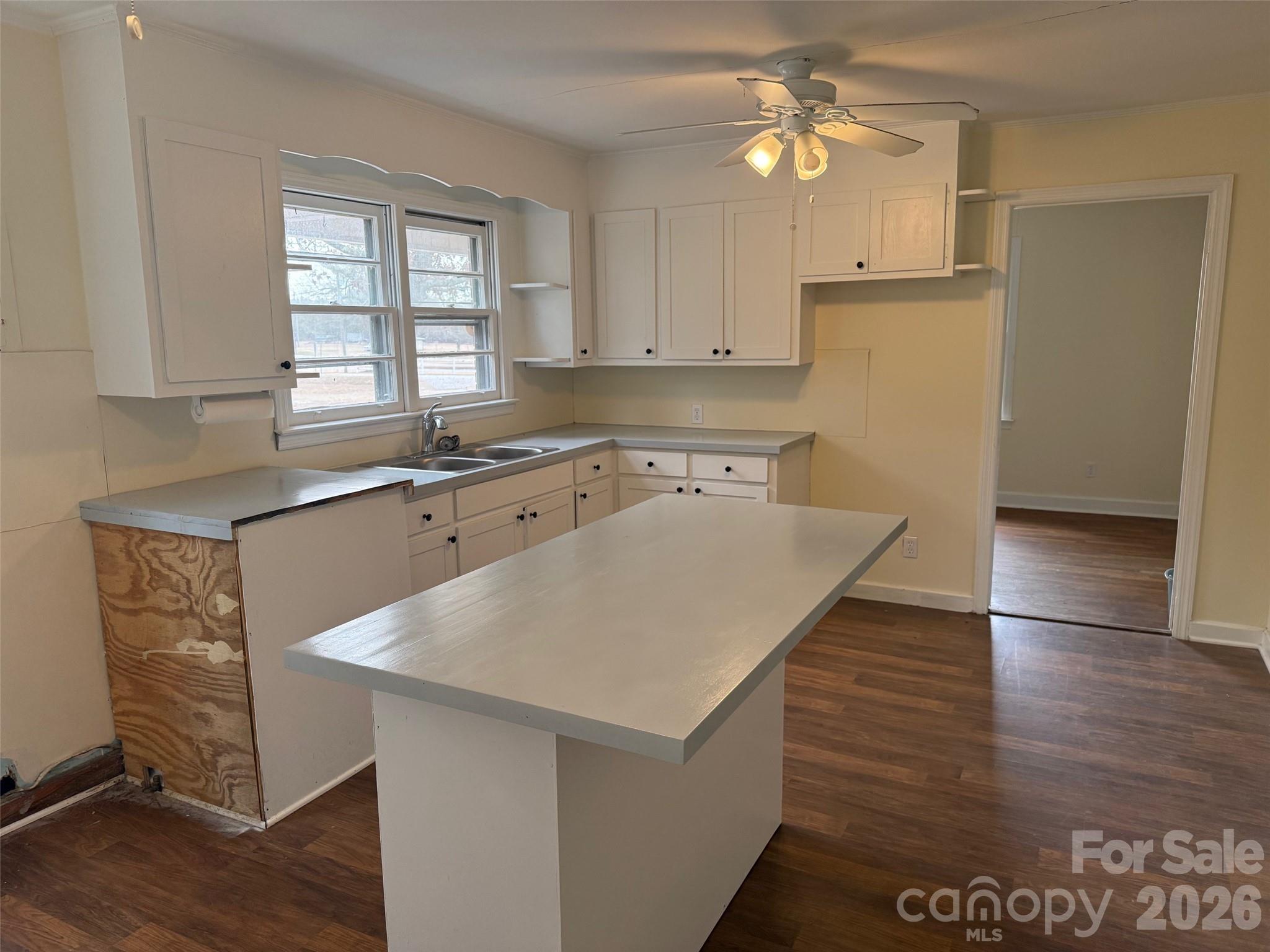 292 Youngs Bend Road Kershaw, SC 29067 - Photo 8 of 18 a kitchen with a appliances a sink cabinets and wooden floor