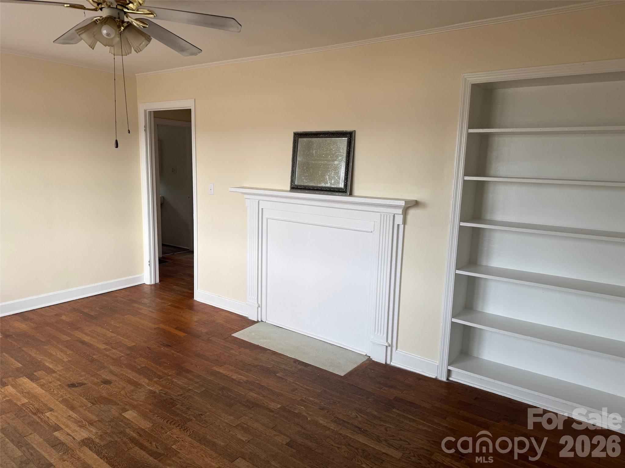 292 Youngs Bend Road Kershaw, SC 29067 - Photo 9 of 18 a view of an empty room with a window and wooden floor