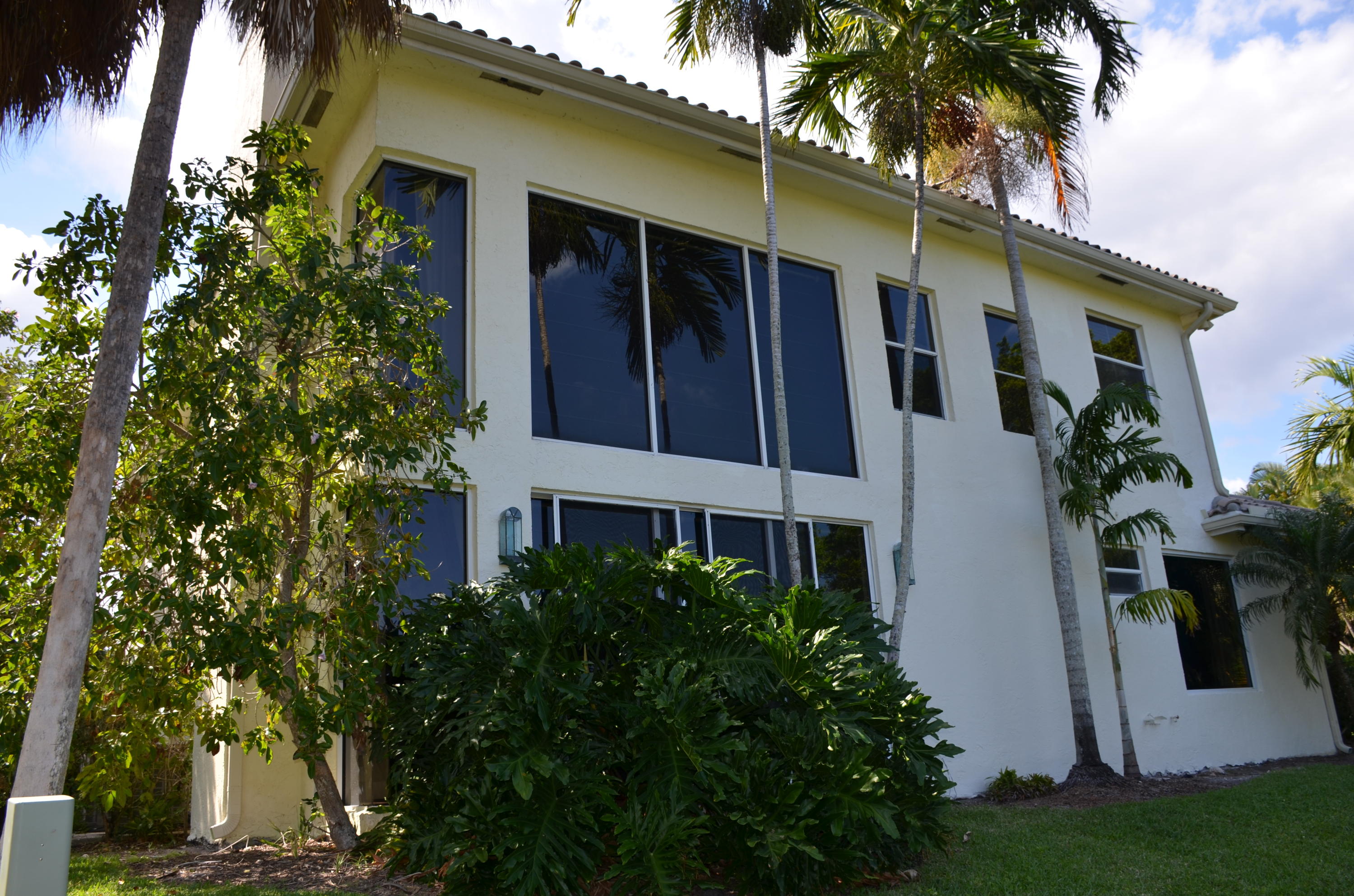1200 Parkside Avenue Boca Raton, FL 33486 - Photo 11 of 33 a house that has a tree in front of the house