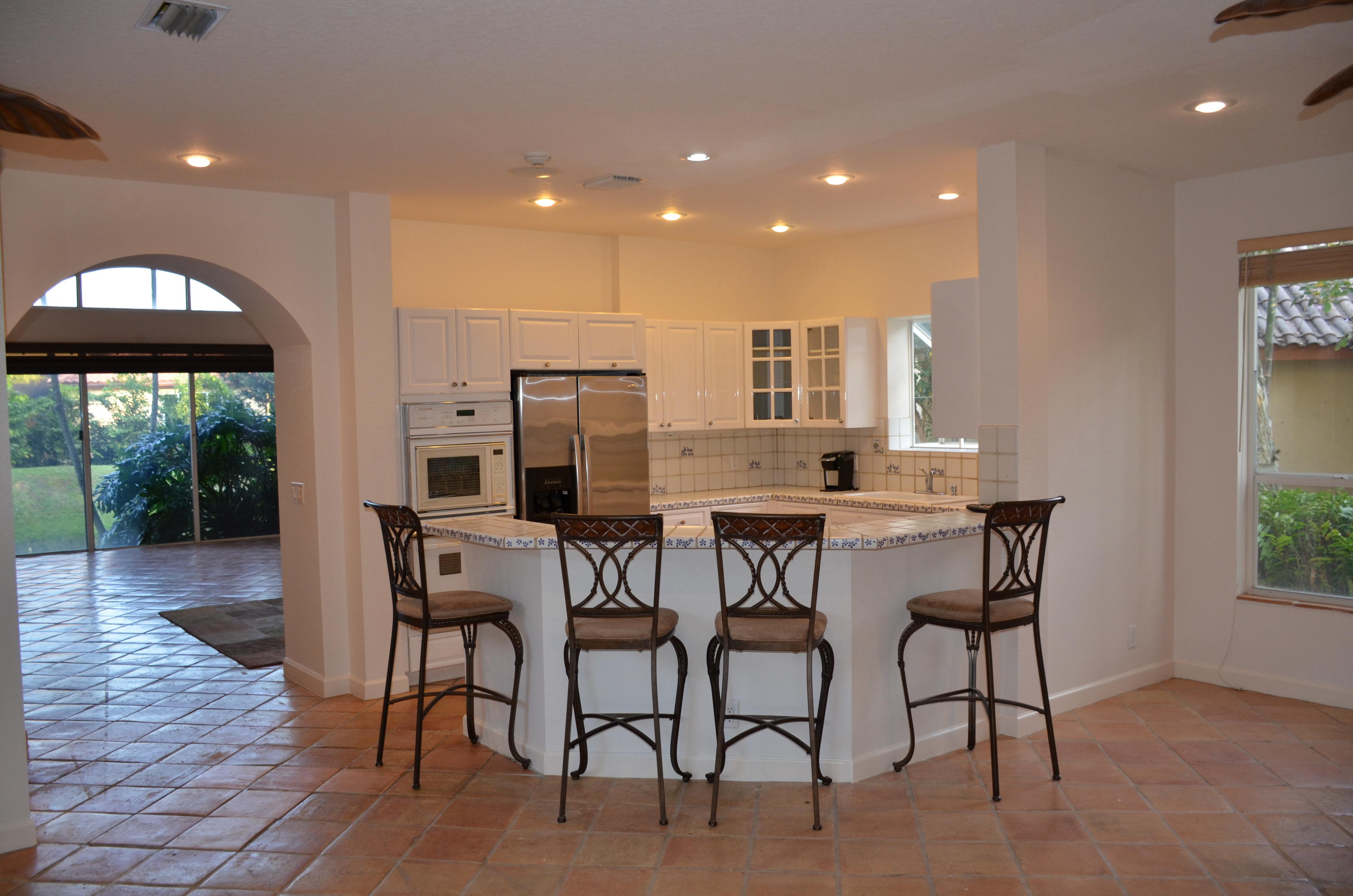 1200 Parkside Avenue Boca Raton, FL 33486 - Photo 13 of 33 a view of a dining room with furniture and wooden floor