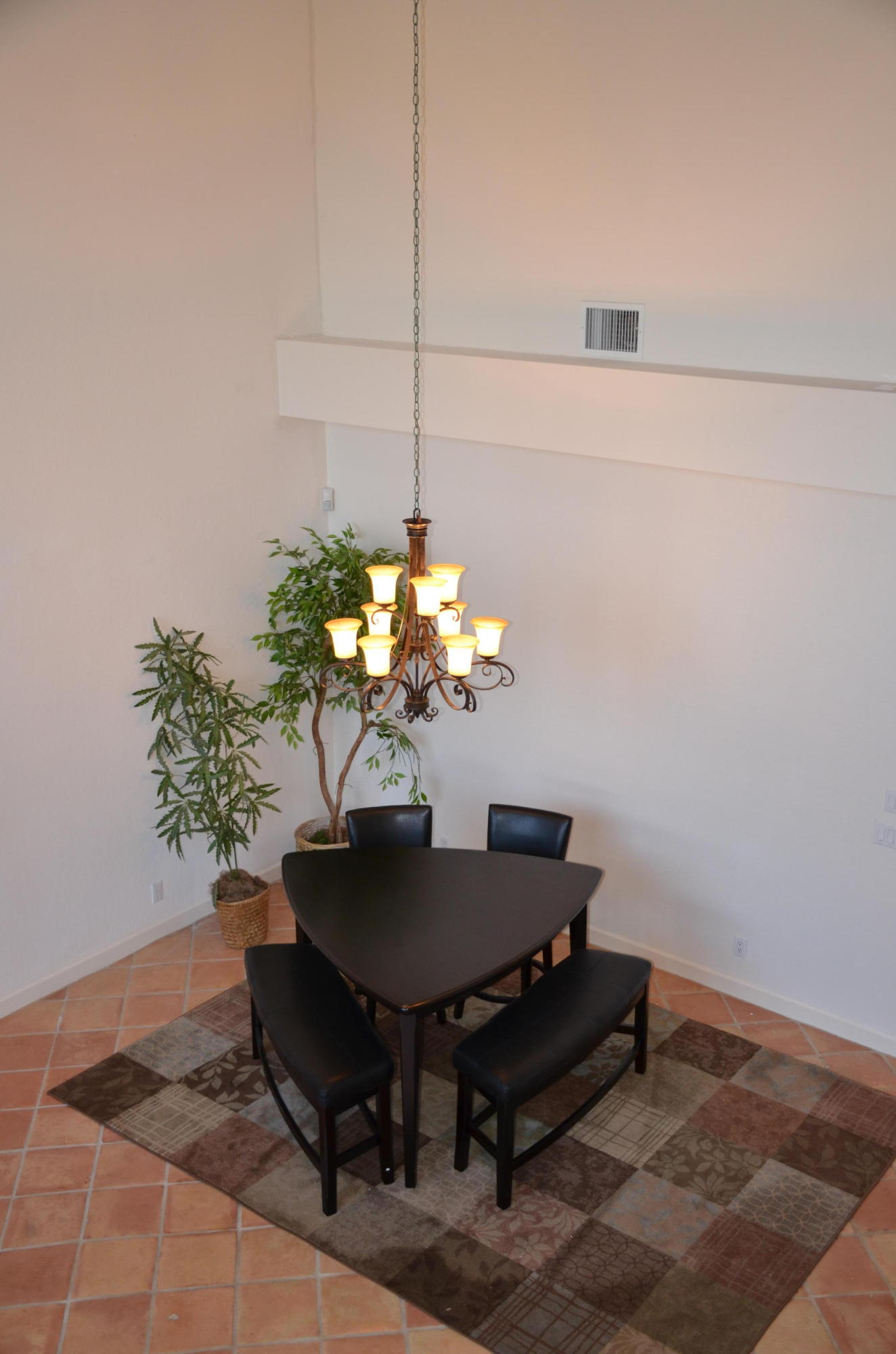 1200 Parkside Avenue Boca Raton, FL 33486 - Photo 19 of 33 a dining room with furniture and a potted plant
